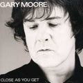 the album cover for Gary Moore - Close As You Get