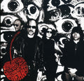 the album cover for Outrageous Cherry - Wide Awake In The Spirit World: Best Of Outrageous Cherry