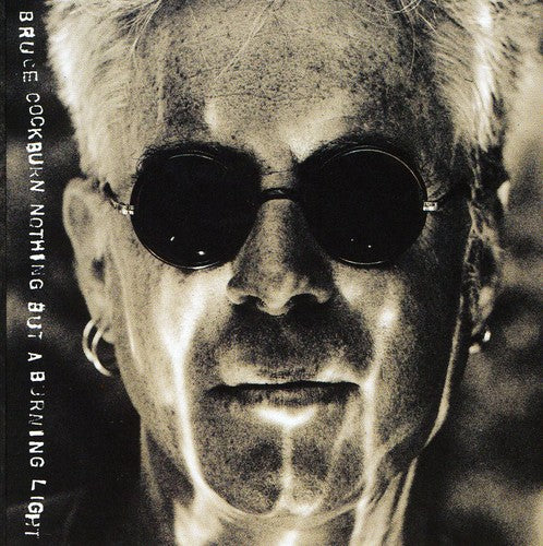 the album cover for Bruce Cockburn - Nothing But a Burning Light