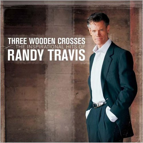 the album cover for Randy Travis - Three Wooden Crosses: The Inspirational Hits Of Randy Travis