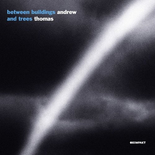 the album cover for Andrew Thomas - Between Buildings and Trees