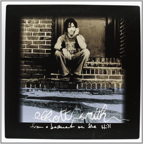 the album cover for Elliott Smith - From a Basement on the Hill