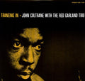 the album cover for John Coltrane With The Red Garland Trio - Traneing in