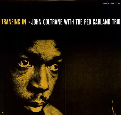 the album cover for John Coltrane With The Red Garland Trio - Traneing in