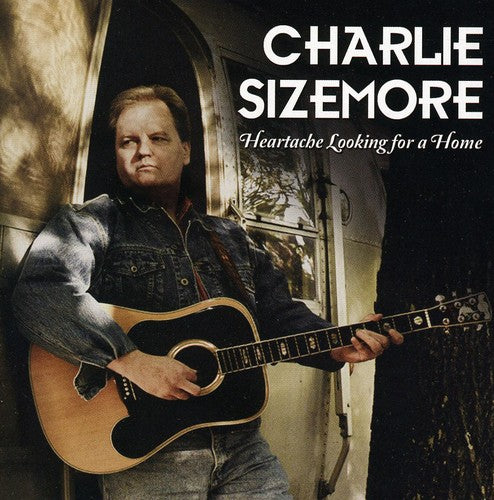 the album cover for Charlie Sizemore - Heartache Looking for a Home