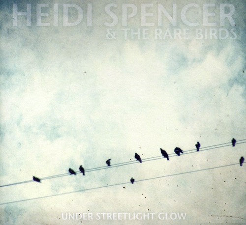 the album cover for Heidi Spencer & The Rare Birds - Under Streetlight Glow