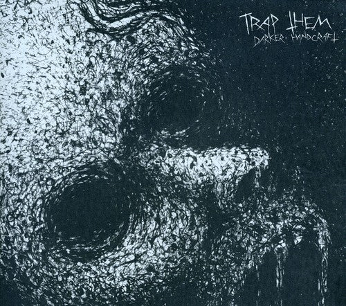 the album cover for Trap Them - Darker Handcraft