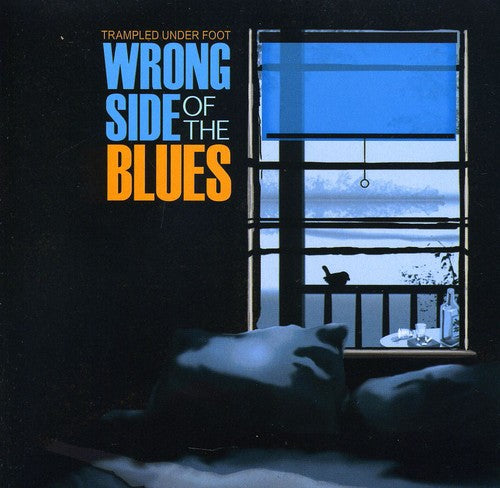 the album cover for Trampled Under Foot - Wrong Side of the Blues