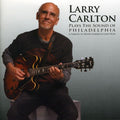 the album cover for Larry Carlton - Plays the Sound of Philadelphia