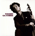 the album cover for Woody Guthrie - This Machine Kills Fascists