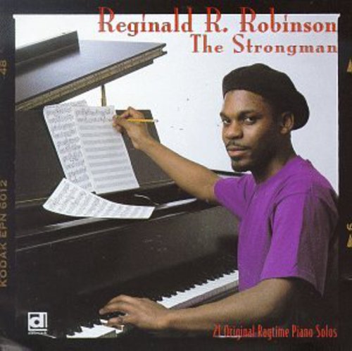 the album cover for Reginald R. Robinson - Strong Man