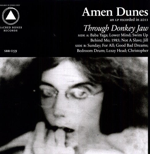 the album cover for Amen Dunes - Through Donkey Jaw