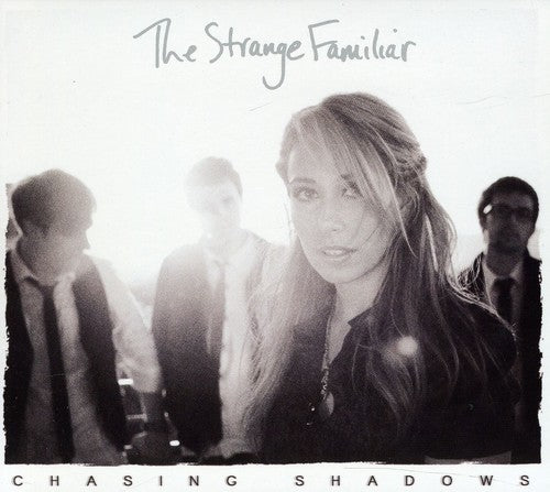 the album cover for Strange Familiar - Chasing Shadows