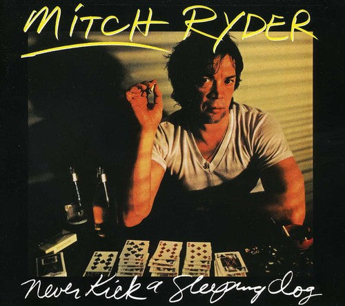 the album cover for Mitch Ryder - Never Kick A Sleeping Dog [Import]