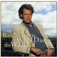 the album cover for Randy Travis - Wind in the Wire