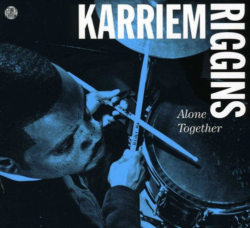 the album cover for Karriem Riggins - Alone Together