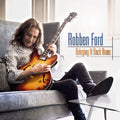 the album cover for Robben Ford - Bringing It Back Home