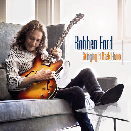 the album cover for Robben Ford - Bringing It Back Home
