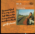 the album cover for Lee Hazlewood - Trouble Is A Lonesome Town