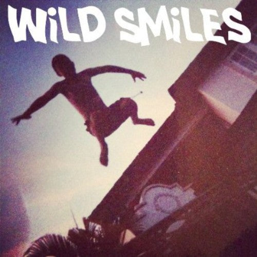 the album cover for Wild Smiles - Tangled Hair / Sweet Sixteen