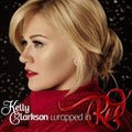 the album cover for Kelly Clarkson - Wrapped in Red