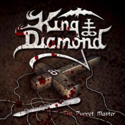the album cover for King Diamond - The Puppet Master