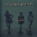 the album cover for The Howlin' Brothers - Trouble [Vinyl]