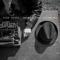 the album cover for John Hiatt - Terms of My Surrender