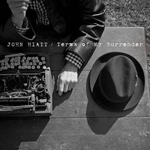 the album cover for John Hiatt - Terms of My Surrender