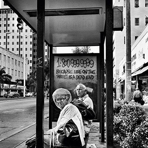the album cover for Millie & Andrea - Drop the Vowels