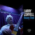 the album cover for Larry Coryell - Heavy Feel
