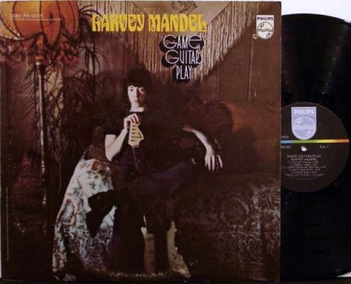 the album cover for Harvey Mandel - Games Guitars Play