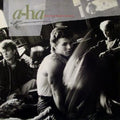 the album cover for A-Ha - Hunting High And Low [LP]