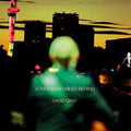 the album cover for David Gray - A Thousand Miles Behind