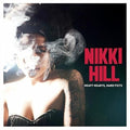 the album cover for Nikki Hill - Heavy Hearts Hard Fists