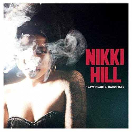 the album cover for Nikki Hill - Heavy Hearts Hard Fists