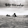 the album cover for Jack Johnson - Thicker Than Water [LP]
