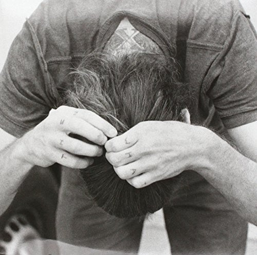 the album cover for Self Defense Family - When the Barn Caves in