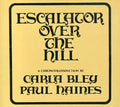 the album cover for Carla Bley - Escalator Over The Hill [Import]