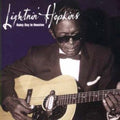 the album cover for Lightnin' Hopkins - Rainy Day in Houston