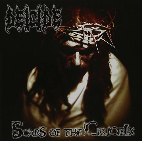 the album cover for Deicide - Scars of The Crucifix