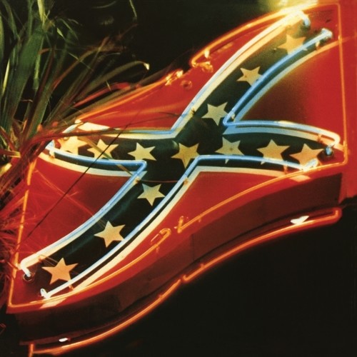 the album cover for Primal Scream - Give Out But Don't Give Up