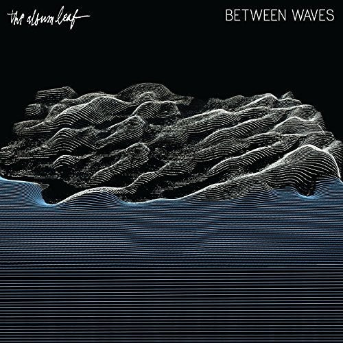 the album cover for The Album Leaf - Between Waves [Limited Edition Blue Vinyl]