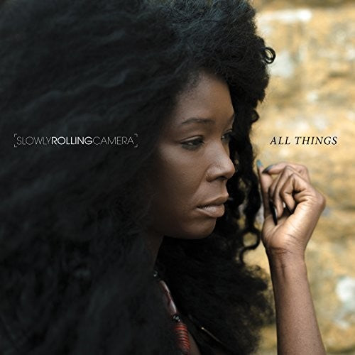 the album cover for Slowly Rolling Camera - All Things