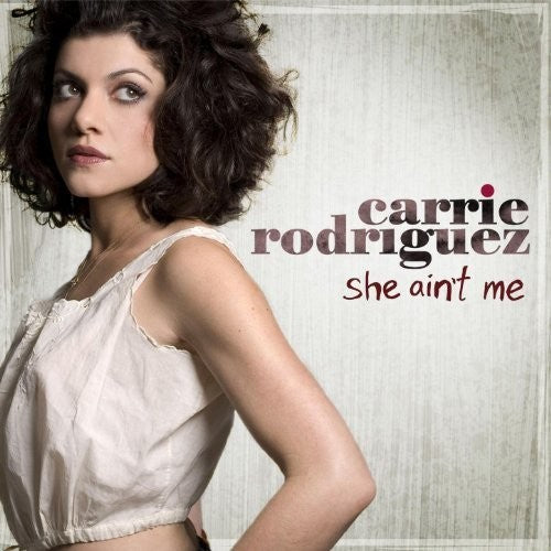 the album cover for Carrie Rodriguez - She Ain't Me