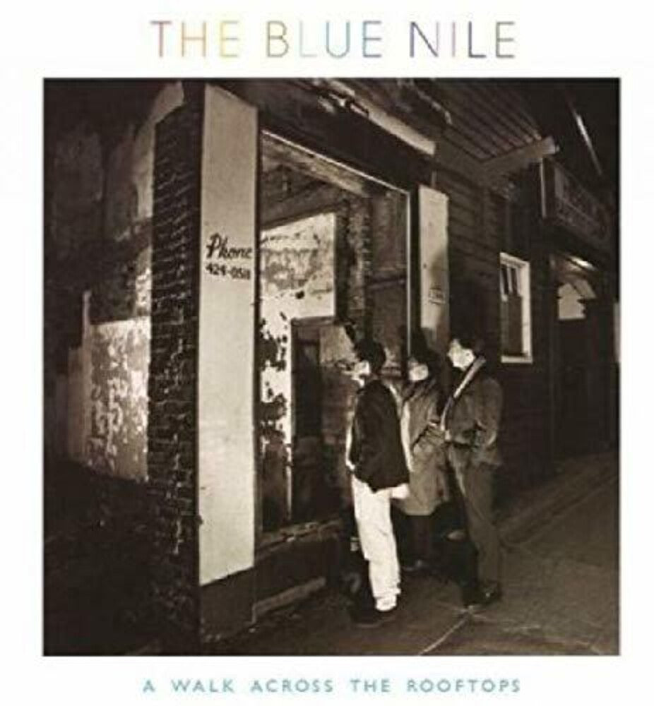 the album cover for Blue Nile - Walk Across The Rooftops