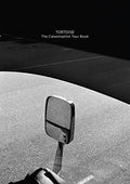 the album cover for Tortoise - Catastrophist Cd & Tour Book (W/Book)