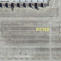 the album cover for Fitted - First Fits [Limited Edition Silver LP]