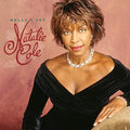 the album cover for Natalie Cole - Holly & Ivy