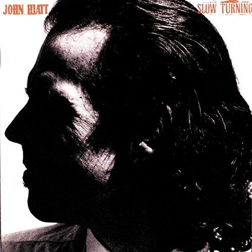 the album cover for John Hiatt - Slow Turning